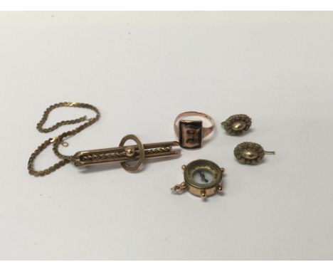 A small collection of jewellery including gold comprising brooch chain , compass, ring and a pair of earrings