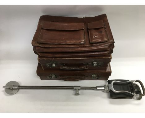 Two vintage suitcases, a leather briefcase and a shooting stick (4).