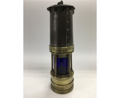 A rare vintage miners lamp with blue glass shade, approx 27.5cm.