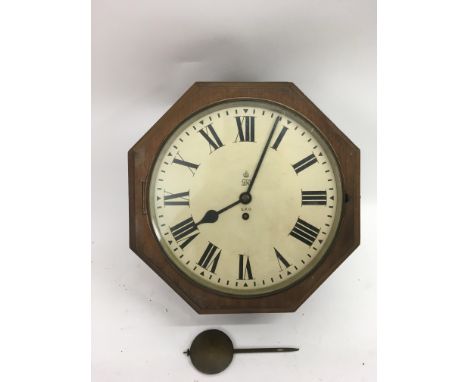 An octagonal shape, GPO double sided clock and pendulum.Approx 37cm diameter