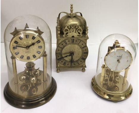 A brass dome clock and two Anniversary clocks, one by Bentima