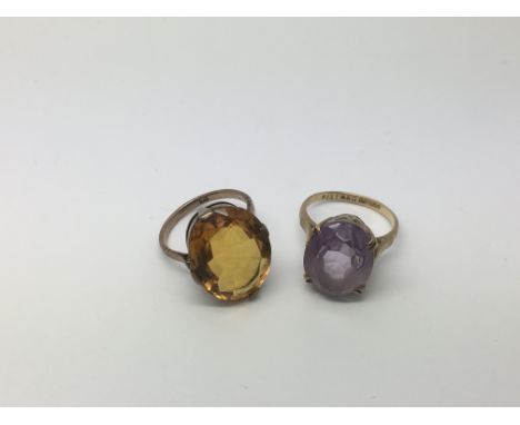 Two 9ct gold rings set with polished stones, approx 9.1g and approx sizes K-L and M-N.