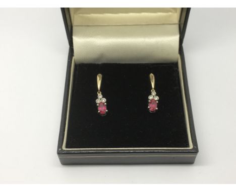 A pair of 9k diamond and ruby drop earrings, approx 2.7g.