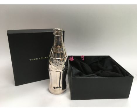 A boxed limited edition sterling silver full scale replica of a Diet Coke bottle by Theo Fennell. This is one of only 16 spec
