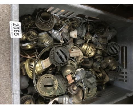 A box containing mixed oil lamp burners