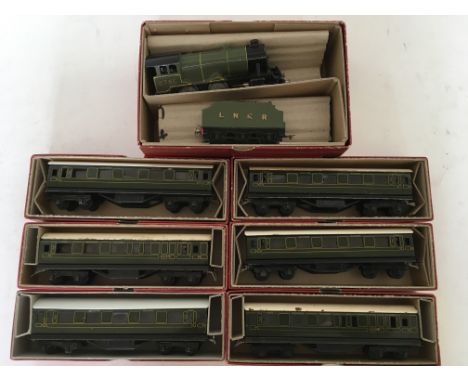 A collection of Trix twin railway , HO and OO scale, including a 4-4-0 LNER, #2750 locomotive, pytchley, along with 6 carriag