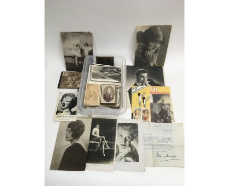 A box containing a collection of postcards including some signed portrait cards of film and theatre stars plus a signed typed
