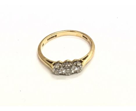 An 18carat gold ring inset with three brilliant cut diamonds. Ring size L-K.