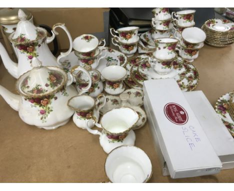 A Come of royal Albert country rose including coffee pot tea pot cups and saucers