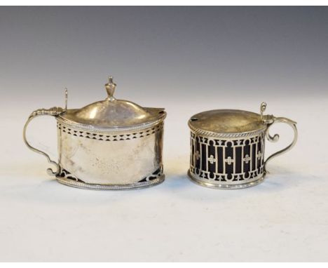 Two silver mustard pots, the first London 1786 of oval form, the second Birmingham 1909 of pierced drum form, total weight 6.