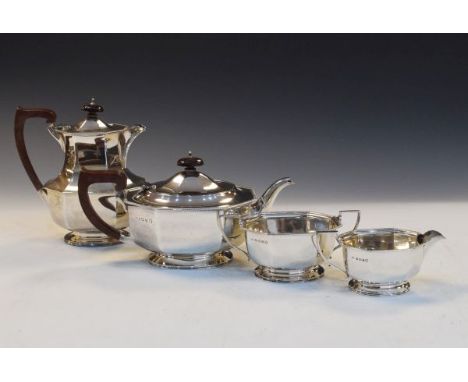 George V silver Art Deco tea service comprising: tea pot, hot water jug, two handled sugar and milk jug, each of octagonal fo