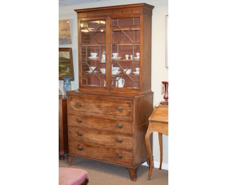 George III mahogany two section secretaire bookcase, the upper section fitted four shelves enclosed by a pair of astragal gla