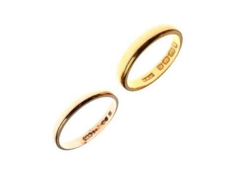Two yellow metal wedding bands, the first 22ct gold, size M½, the second size N indistinctly marked, total weight 5.4g gross 