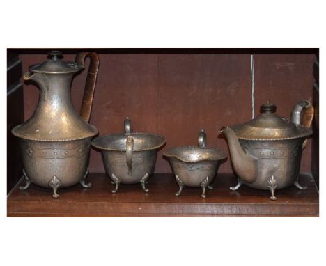Early 20th Century hammered pewter four piece tea service comprising: teapot, hot water jug, cream jug and sugar basin   Cond