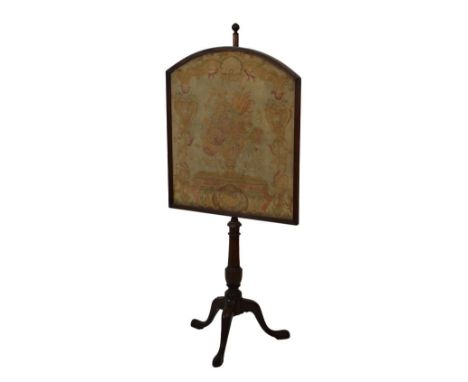 19th Century mahogany polescreen, having a tapestry panel with floral decoration, standing on a turned pillar and tripod base