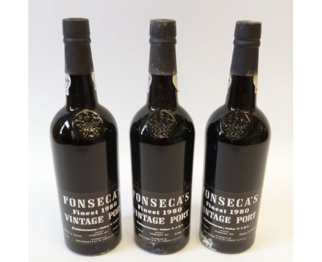 THREE BOTTLES OF FONSECA'S VINTAGE PORT, 1980, with wooden crate, only one board to top (4) 