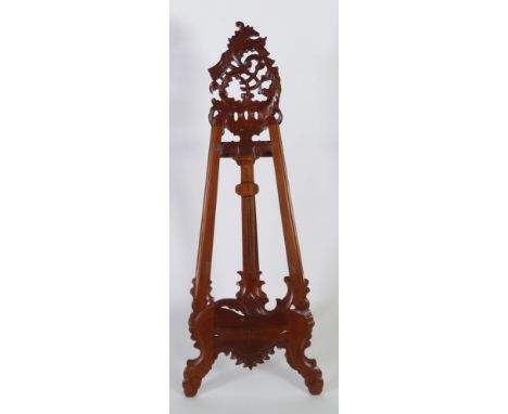 ROCOCO STYLE CARVED RED WOOD DISPLAY EASEL, with scroll pierced cresting, 59 59 1/2" (151.2cm) high, (easel support loose) 