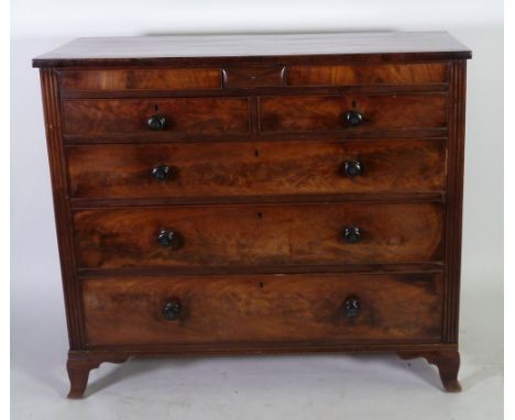 EARLY VICTORIAN FIGURED MAHOGANY CHEST OF DRAWERS, the oblong top above two secret drawers to the frieze, and two short and t