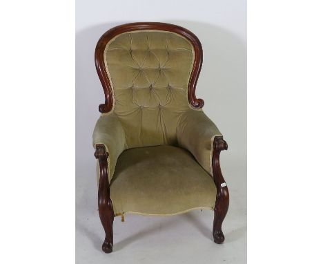 LATE VICTORIAN MAHOGANY SPOON BACK EASY ARMCHAIR, the waisted deep button back with moulded show wood outline, above flat arm