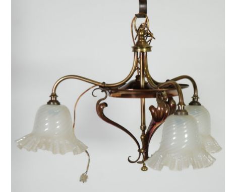 ARTS AND CRAFTS BRASS AND COPPER THREE LIGHT ELECTROLIER, the scroll arms with frosted wrythen moulded  glass shades with fri