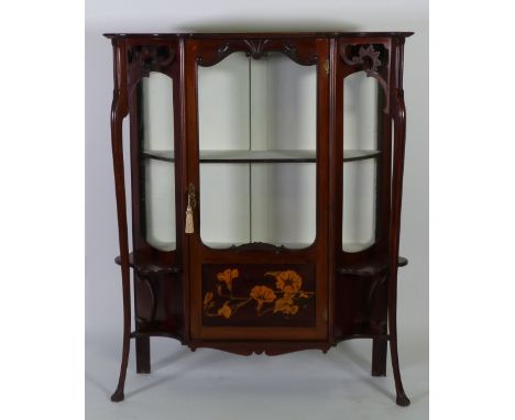 ART NOUVEAU MAHOGANY AND FLORAL MARQUETRY DISPLAY CABINET, the moulded shaped oblong top above a central  cupboard door  with