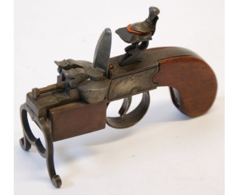 DUNHILL 'TINDER PISTOL' TABLE CIGARETTE LIGHTER, in the form of a flintlock belt pistol, pat. 19273/34 Reg No. 794093 