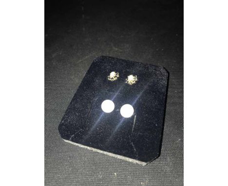TWO PAIRS OF STUD EARRINGS one pair of opal set with sapphires in gold and the other pair pearl studs