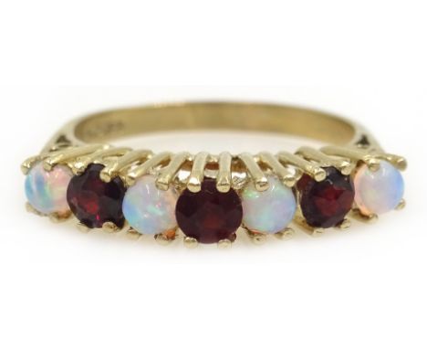 Opal and garnet gold ring, hallmarked 9ct  Condition Report Size M, approx 2.1gm