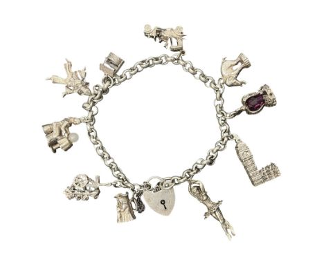 Silver charm bracelet, with ten charms including fortune teller, wishing well, crown, toby jug, ballerina and a heart padlock