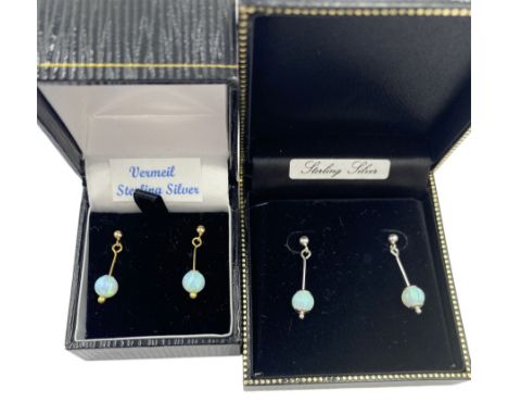 Pair of silver-gilt opal pendant earrings, together with a similar pair of silver opal pendant earrings, both boxed 