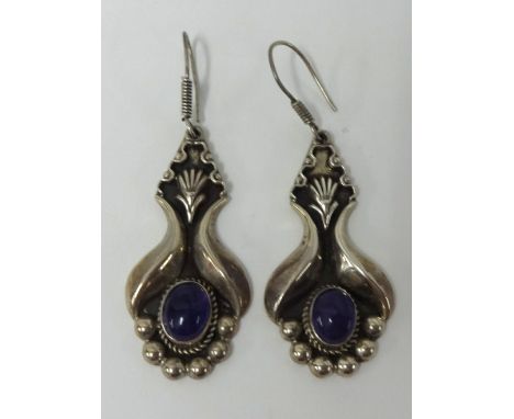 A pair of silver and amethyst style pair of earrings and various costume jewellery and a Five Pound coin