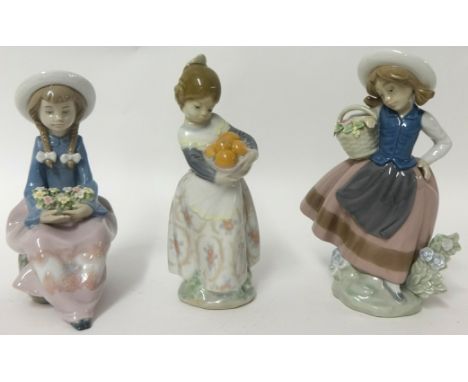 Three Lladro figure depicting two girls with baskets of flowers, one with fruit (3)
