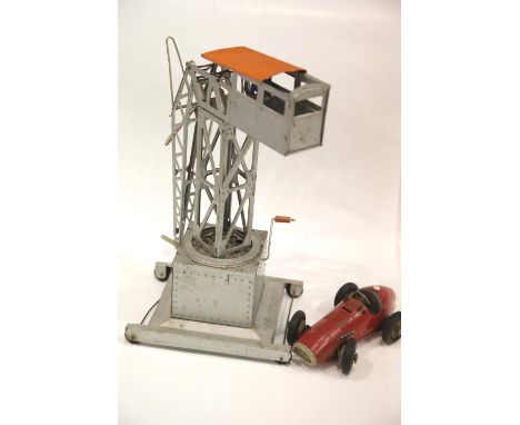 Schuco Clockwork PMX racing car and a large tinplate toy crane. P&P Group 1 (£14+VAT for the first lot and £1+VAT for subsequ