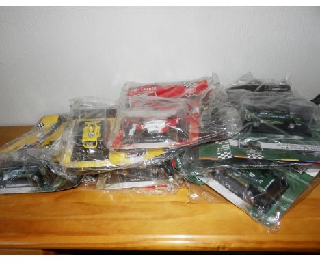 10x Carded with Magazines Mixed Formula 1 Racing cars.P&amp;P Group 1 (£14+VAT for the first lot and £1+VAT for subsequent lo