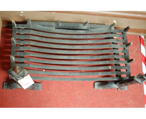 A pair of black painted cast iron andirons; together with matching fire grate; and a further single cast iron fire grate (4)