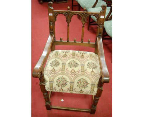 A set of eight 17th century style carved and joined oak dining chairs, each having turned arched backs, with conforming tapes