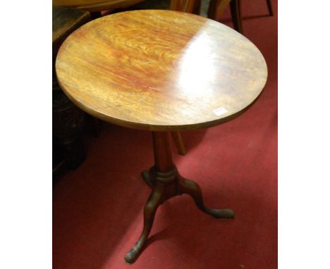 A 19th century mahogany circular topped pedestal tripod table