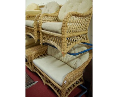 A contemporary wicker conservatory suite comprising; two seater sofa, pair of armchairs, and a two tier table (4)