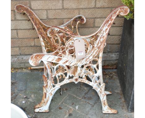 A pair of Regency style white painted and pierced metal garden bench ends, only