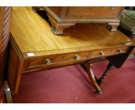 A 19th century mahogany and ebony strung round cornered dropflap sofa table, having twin frieze drawers