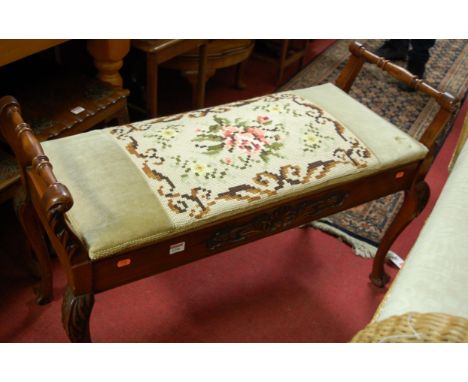 An Edwardian low relief carved walnut tapestry upholstered hinge top duet music seat