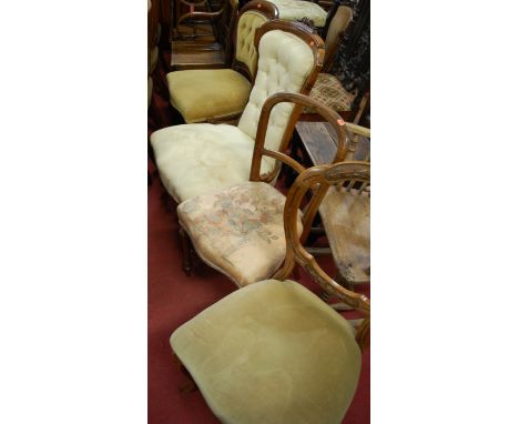 A collection of various chairs to include; an early 20th century oak stickback elbow chair, beech stickback tapestry seat bed