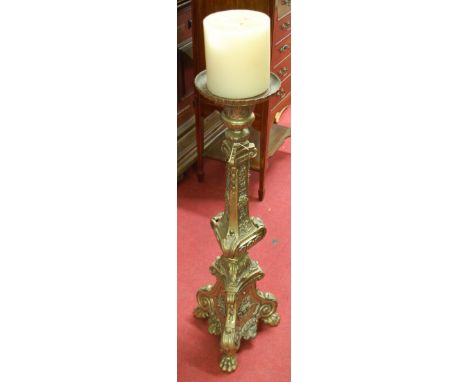 A Baroque style cast brass freestanding pricket stick