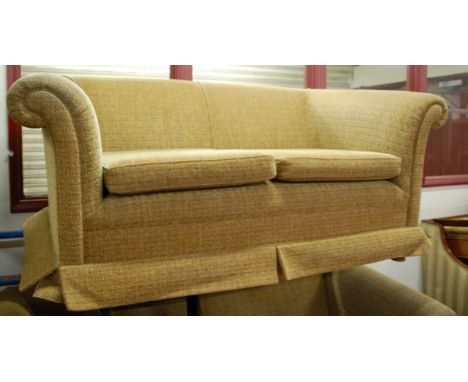 A Victorian style floral upholstered two piece suite, comprising three seater and two seater sofa, each on turned supports 