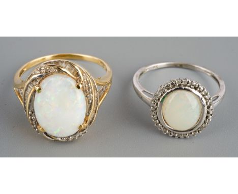Two modern hallmarked gold oval opal and diamond illusion set dress rings, comprising a 9ct white gold ring, UK size O.5, 2.2