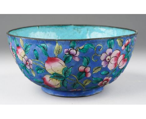 A Chinese enamel bowl of circular form, turquoise interior, the exterior with a pale blue ground decorated with flowers, frui