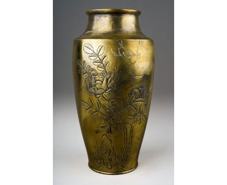 An early 20th century Japanese bronze baluster vase, shallow relief decoration of floral and fauna with some silvered detail,