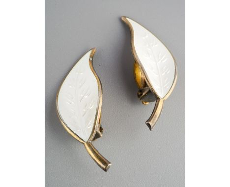 A pair of silver and white enamel leaf form clip on earrings by David Andersen, marked to back