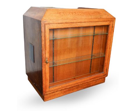 An early 20th century oak and pine cash desk, the angled top stamped along the front with "CASH &amp; APPOINTMENTS" and fitte