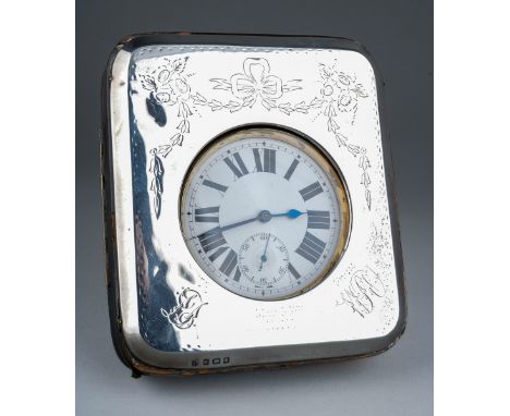 An Edwardian silver mounted watch holder, easel backed., the silver engraved with Neo-Classical ribbon tied swags, with initi